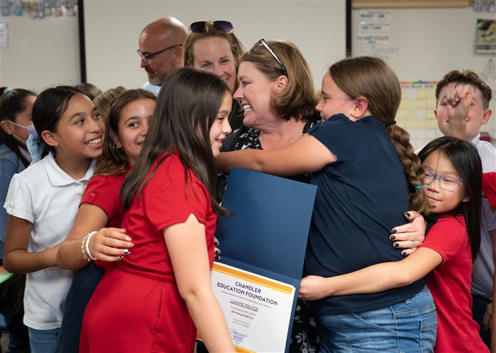  Leanne Prater, a CTA Liberty teacher and her students celebrate receiving a $1,500 grant.